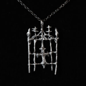 Guardian at the Gate - A sterling silver charm honoring the guardian spirit of the cemetery gate