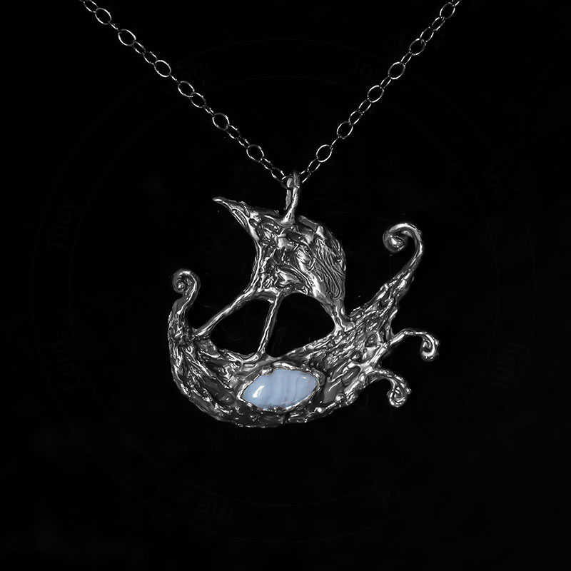 Astrological talismans of Argo Navis featuring blue lace agate above seaweed and 24k gold flake in sterling silver by Sword + Scythe