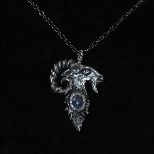 Astrological talismans of fixed star Capella featuring sapphire set with horehound seed in solid sterling silver by Sword + Scythe