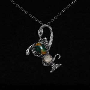 Astrological talismans of Cancer I featuring green jasper and peach moonstone set above oak, moss, and mugwort in solid sterling silver by Sword + Scythe
