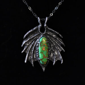 Astrological talismans of constellation Draco featuring turquoise set with apple, 24k gold flake, and dragon's blood resin in solid sterling silver by Sword + Scythe
